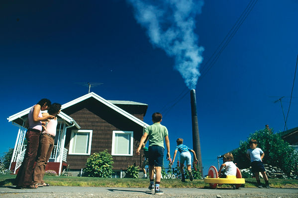 children-play-in-yard-of-ruston-home-while-tacoma-smelter-stack-showers-area-230abe-1024.j