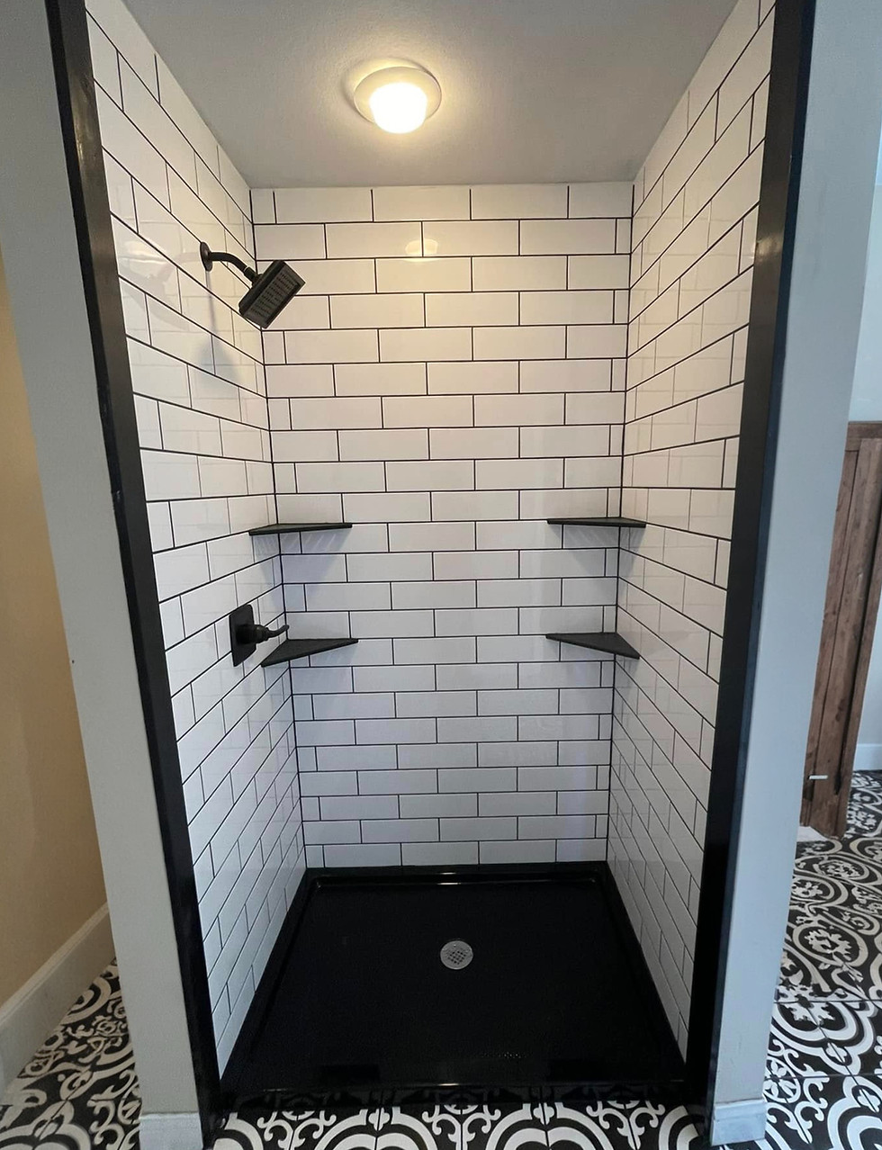 ADA-compliant walk-in shower remodel with black fixtures in Springfield MO.jpg