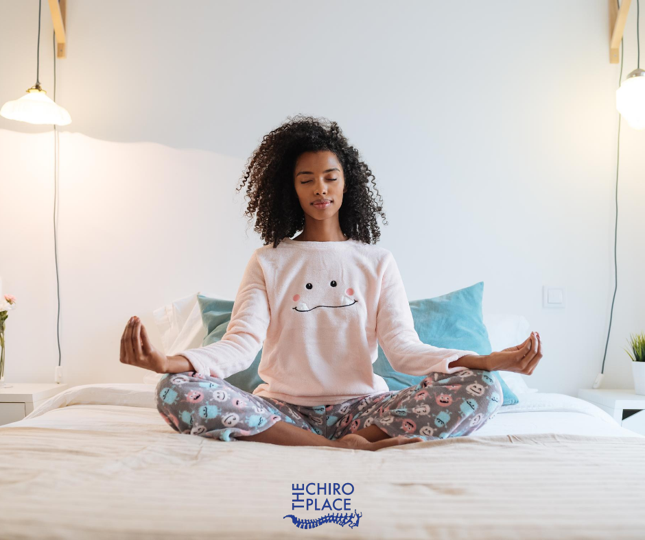 Girl meditating on the bed