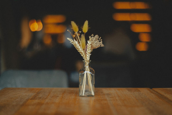 A small bouquet of dried plants in a vase._edited.jpg