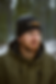 man wearing embroidered beanie with ambition strikes logo