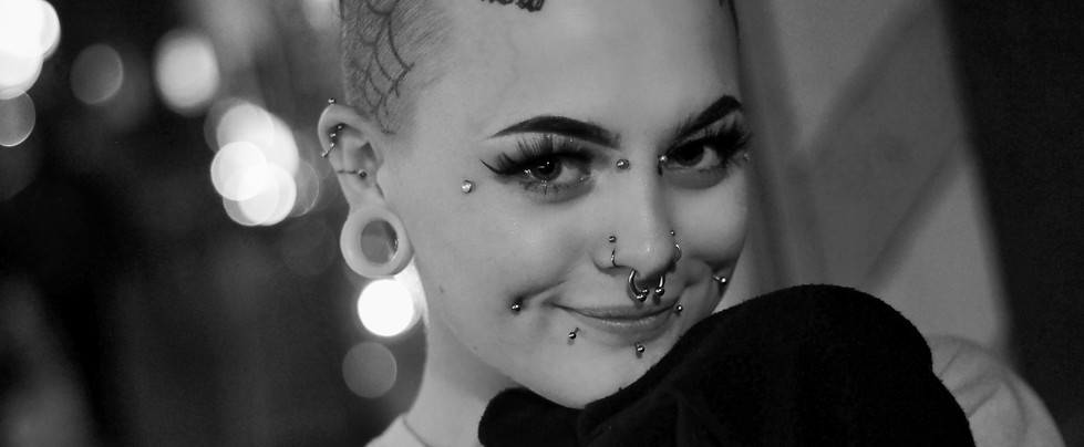 grayscale photo of smiling woman wearing