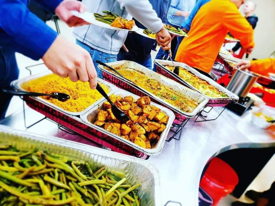 Guests choosing from a JW3 Kitchen catered buffet