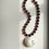 Thumbnail: THE SHELLS NECKLACE IN AUBERGINE