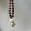 Thumbnail: THE SHELLS NECKLACE IN AUBERGINE
