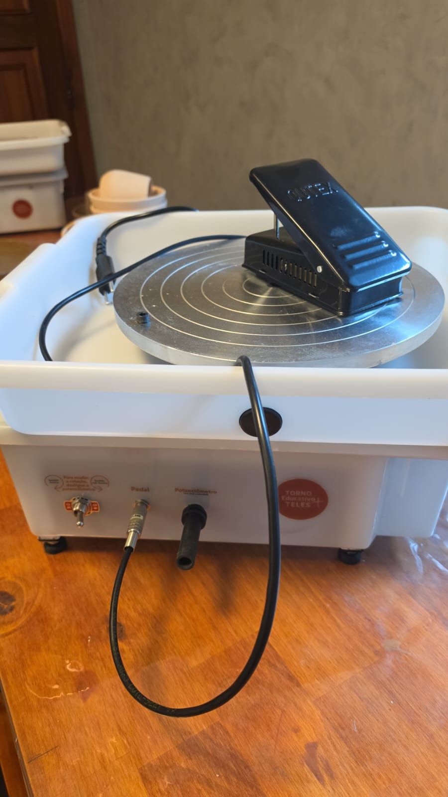 Close-up view of a portable ceramic wheel in use