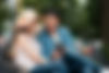 A high-net-worth single sharing photography tips with a model at a Cupic List luxury retreat, fostering connections through their shared passion for photography.