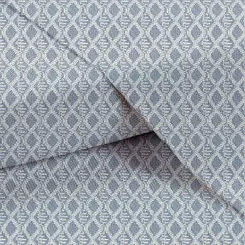 Close-up of cotton yarn-dyed crochet shirt fabric with striped pattern for men's and women's apparel.