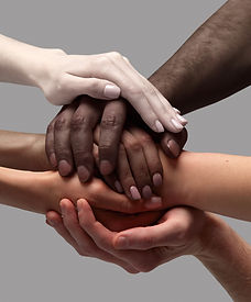 Support and care Human hands of different race, skin color holding together over grey back