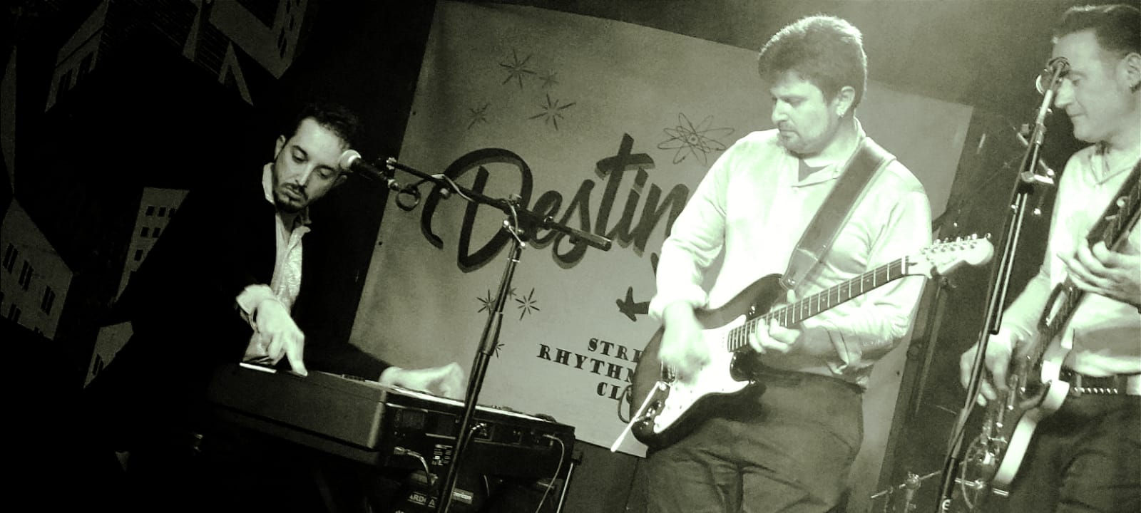 Doc and the Mads piano, guitar and bass playing live