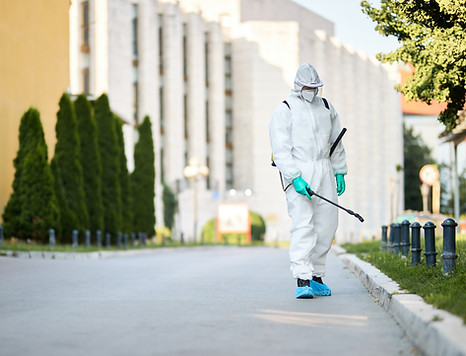 man-protective-suit-disinfecting-city-streets-coronavirus-pandemic (1).jpg