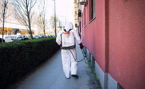 worker-chemical-protection-suit-spraying-disinfectant-public-surfaces_342744-864.jpg