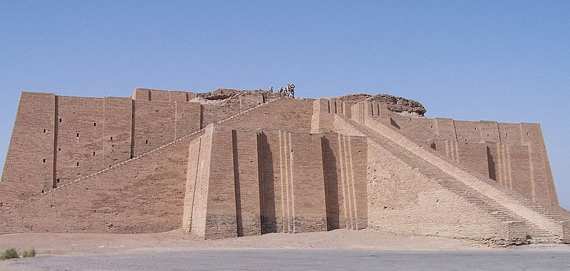 Ancient ziggurat with stepped terraces in a desert. Brown bricks; clear blue sky. No visible text. Calm, historical atmosphere.