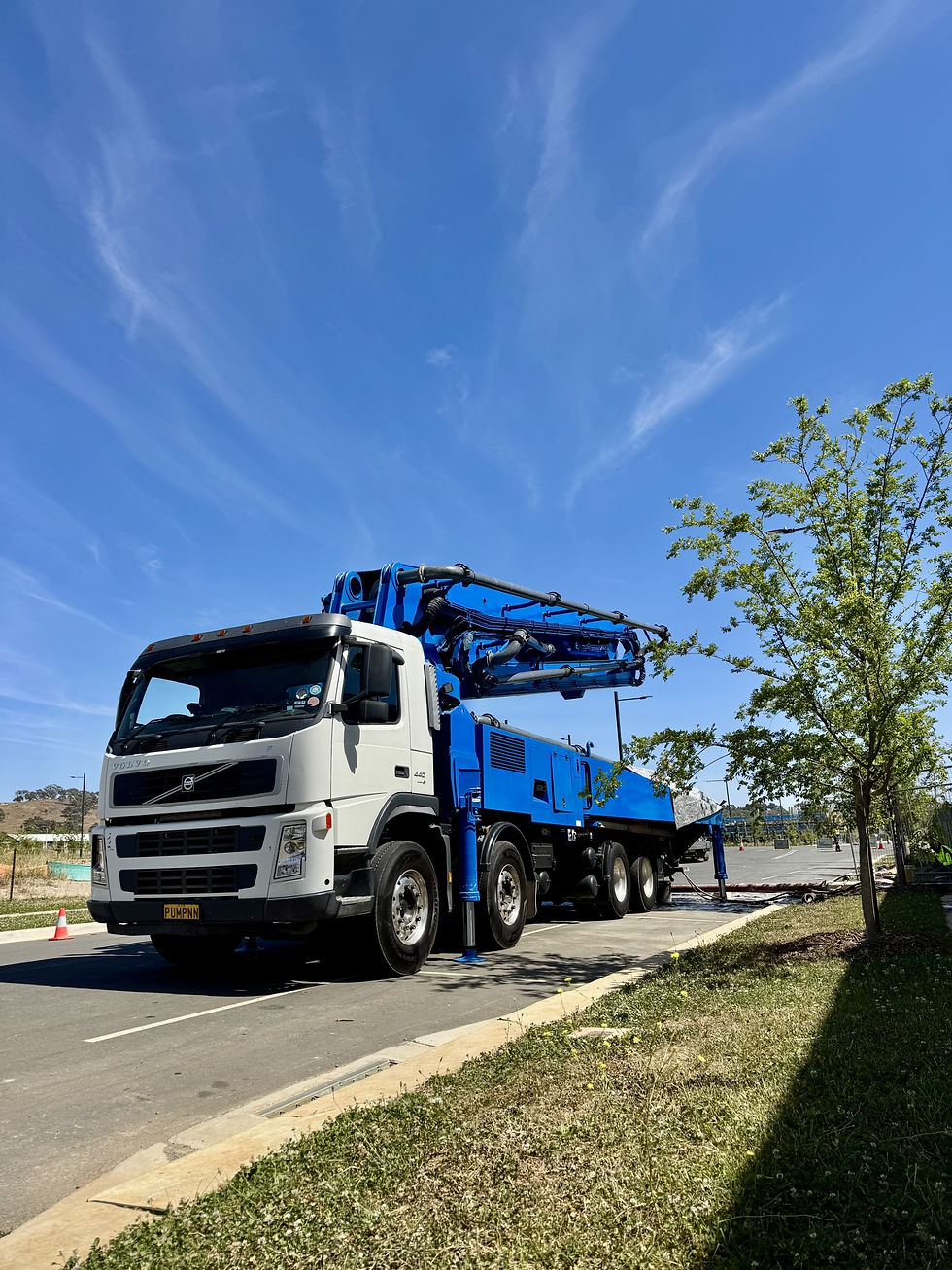 Boom pump delivering concrete on construction site in Canberra ACT