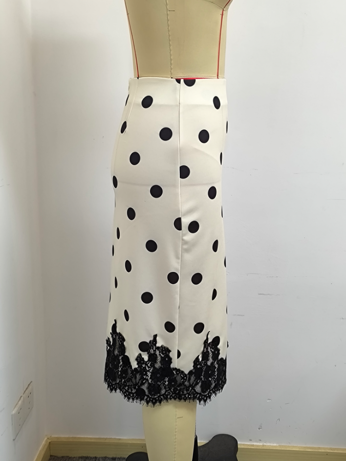Thumbnail: Side view of a polka dot lace high-waist skirt on a mannequin