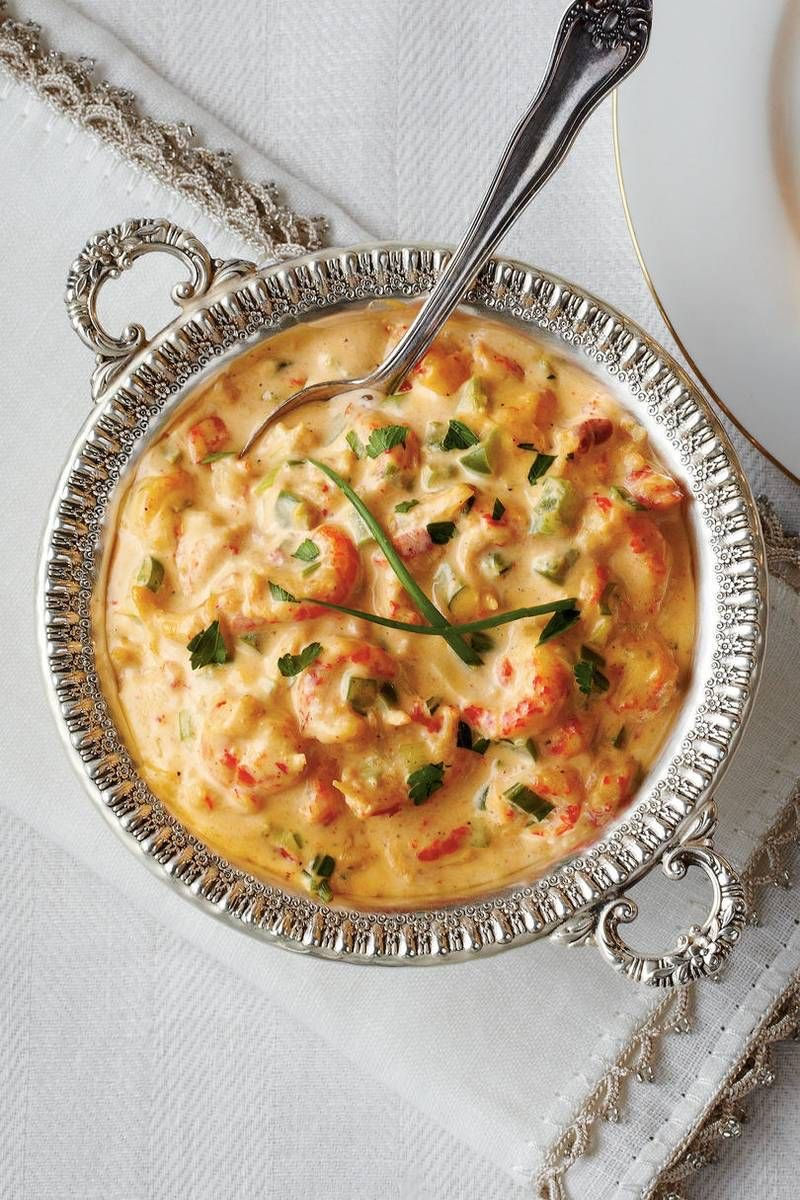 Cajun crawfish dip served with toasted baguette slices.