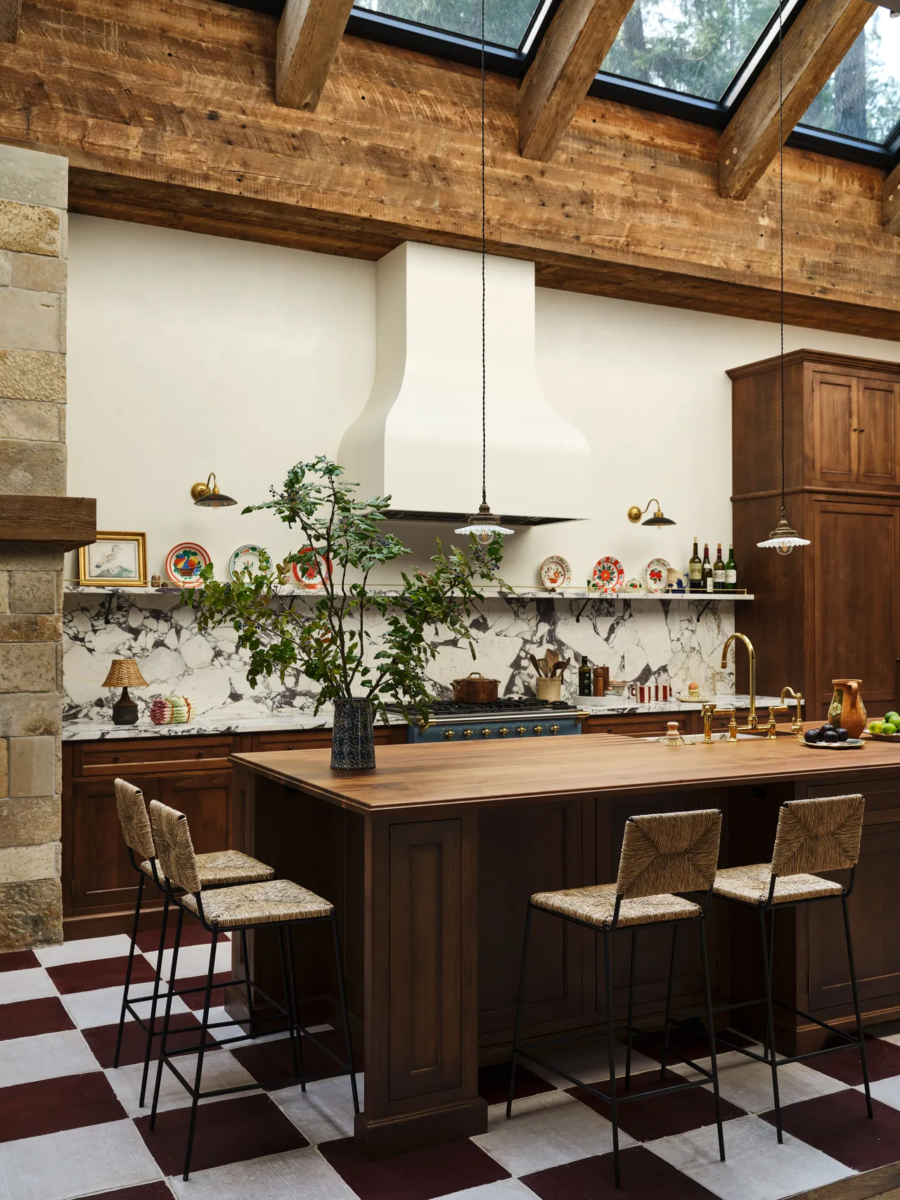 Layered patterns, rich colors, vintage energy. Think Kendall Jenner’s mountain house—collected, cozy, and cool. Slide 3