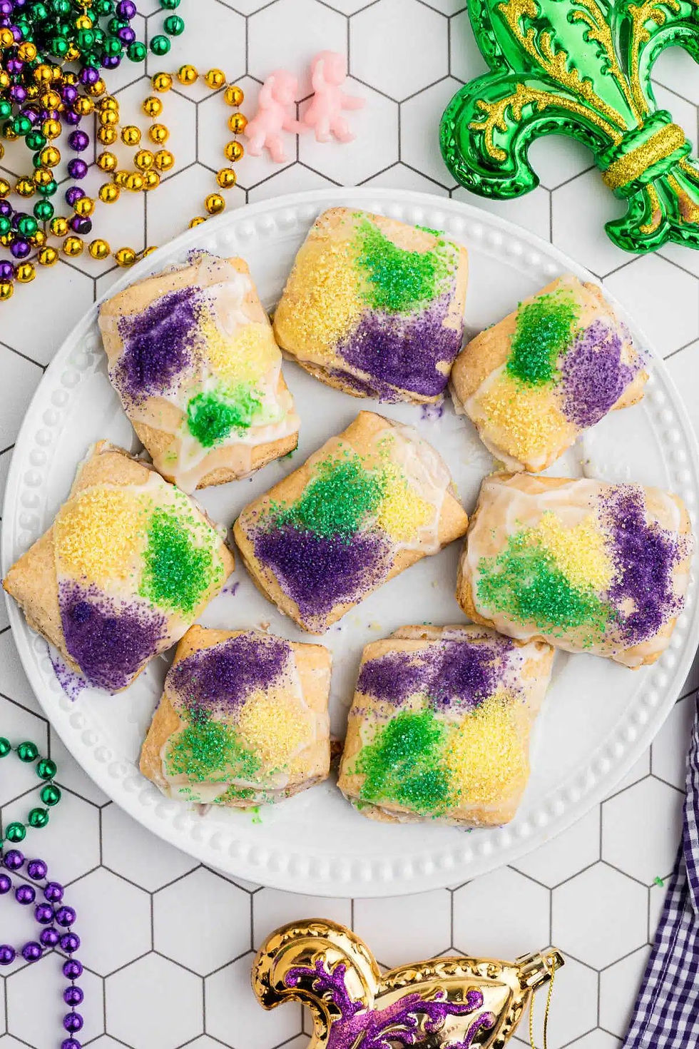 King Cake bites dusted with purple, green, and gold sprinkles.