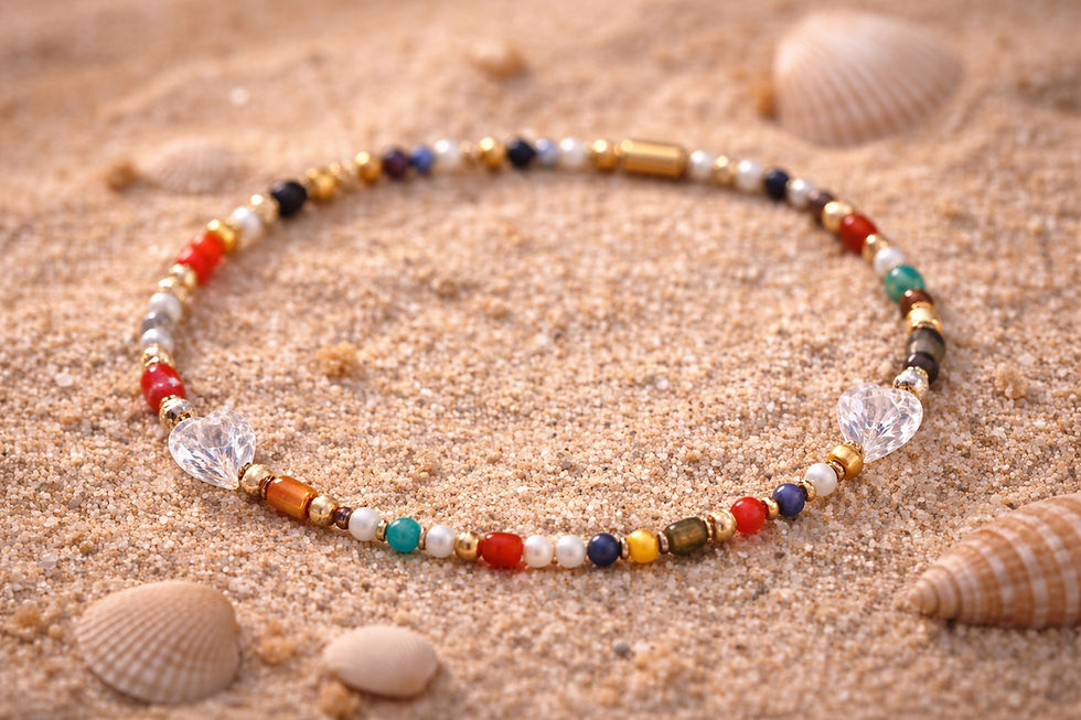 Miniaturbild: Handmade HeartGlow anklet with colorful beads and heart details placed on sand with seashells, boho summer jewelry