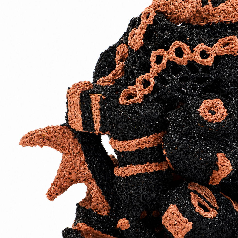 Close-up of Sculpture 860 with black and orange textures.