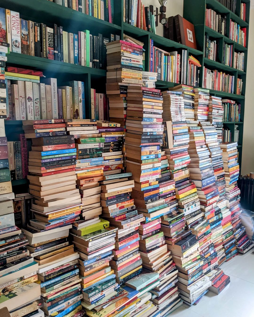 pile of books donated to The Annual Book and Bake Sale Delhi