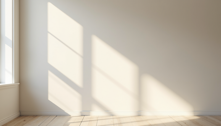 Eye-level view of a freshly painted living room wall with smooth, even coverage