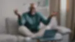 Calm mindful old s business man break sit at home on couch meditating breathing exercise f
