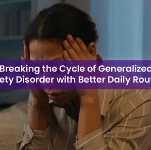 A person sits with hands on their head, reflecting feelings of stress or anxiety. The image highlights the importance of improving daily routines to manage Generalized Anxiety Disorder.