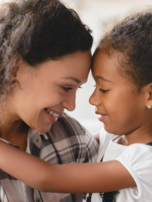 A nurturing moment between parent and child, highlighting the importance of love and understanding in supporting children with ADHD and anxiety.