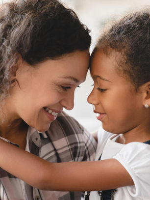 A nurturing moment between parent and child, highlighting the importance of love and understanding in supporting children with ADHD and anxiety.