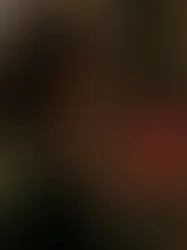 A close up of a person holding a smartphone with news notifications that contribute to war related anxiety and stress.