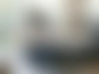 A person sitting on a couch looking tired and overwhelmed by daily anxiety