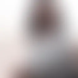 A mother and her daughter sit on a couch, engaging in a serious conversation, reflecting the importance of understanding child and adolescent psychiatry.