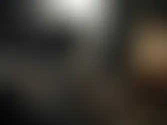 A person sits on a bed, reflected in a mirror, contemplating their mental health journey. This image illustrates the emotional landscape of living with bipolar disorder, supplementing the guide to treatment options available in Dallas and Waxahachie.