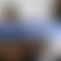 Two men seated on a couch, one holding a glass, the other offering comfort. Text reads, "Treatment-Resistant Depression: When to Consider Advanced Options.