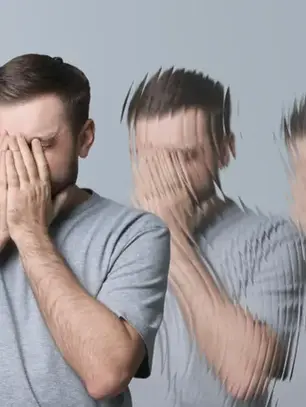 A man stands with his hands covering his face, while multiple blurred images of him suggest emotional turbulence, symbolizing misconceptions about bipolar disorder.