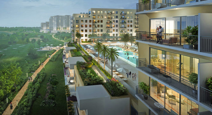 View of a community swimming pool and park within an Emaar South residential cluster.