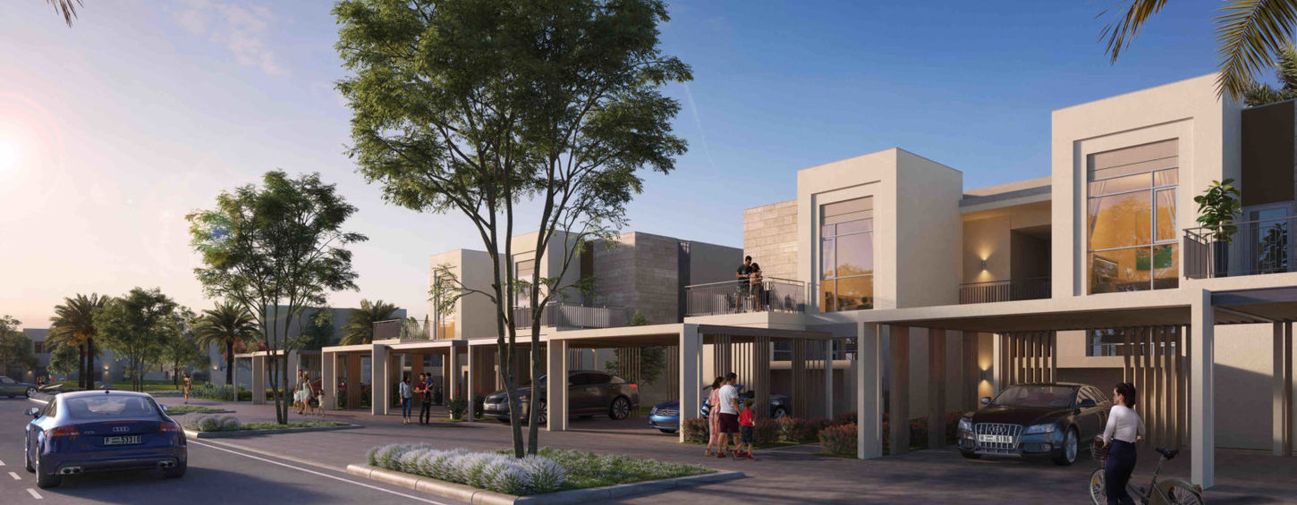 Street view of modern white townhouses with private parking at Emaar South.