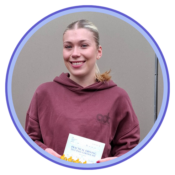 Student driver celebrating first driving achievement with certificate.