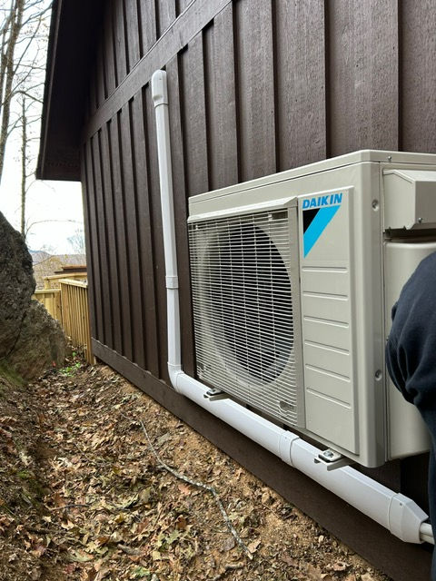 Eye-level view of outdoor air conditioning unit with clear surroundings