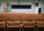 Empty seats in school assembly hall.
