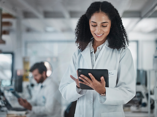 A doctor using a tablet to search for prescriptions