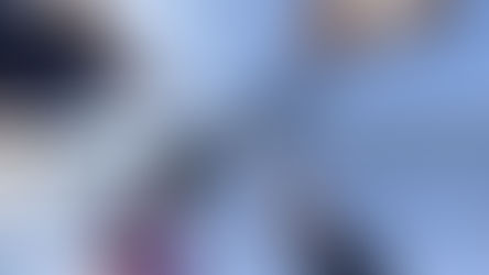 Four people tap rackets over pickleball net