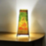 Handpainted Buddha leather lamp glowing with peaceful light, Indian Tholu Bommalata artwork for meditation spaces