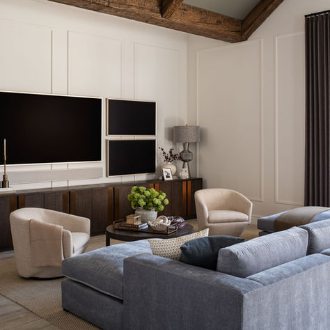 Contemporary great room in a North Central Phoenix home featuring custom architectural molding, wood ceiling beams, built-in media cabinetry, layered furnishings, and full-service interior design by LMOH Home.