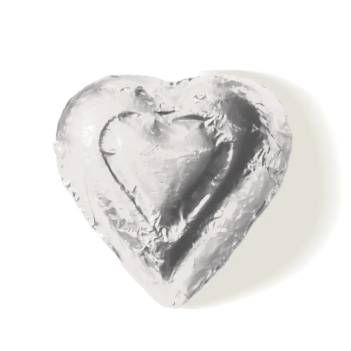 Heart-shaped silver candy foil on white background, Valentine's Day gift.
