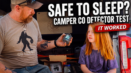 Portable carbon monoxide detector test inside a Yucca-Pac truck camper for family camping safety.