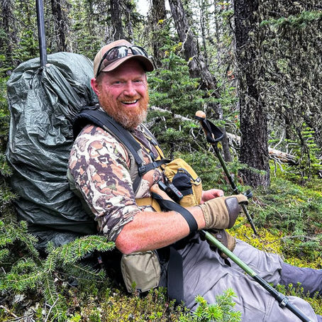 Backcountry hunter carrying mountain hunting pack during sheep hunting gear test
