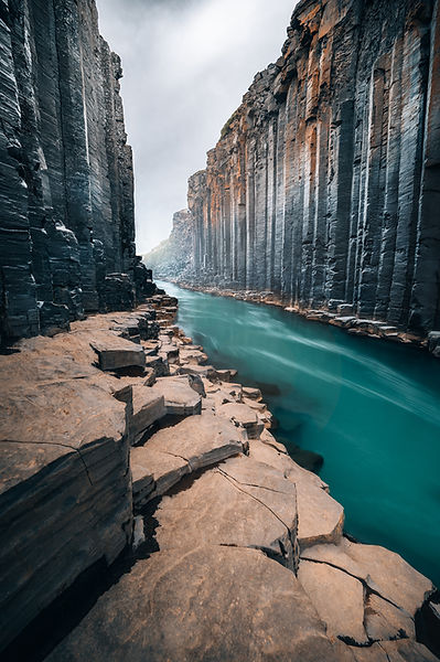 STUÐLAGIL CANYON, also called Studlagil Canyon a canyon with basalt rock in Iceland, with glacier water flowing through