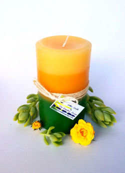 yellow and green plumeria candle
